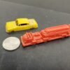 VINTAGE LOT OF 2 PLASTIC MODELS FEATURING YELLOW CADILLAC & RED FIRE TRUCK
