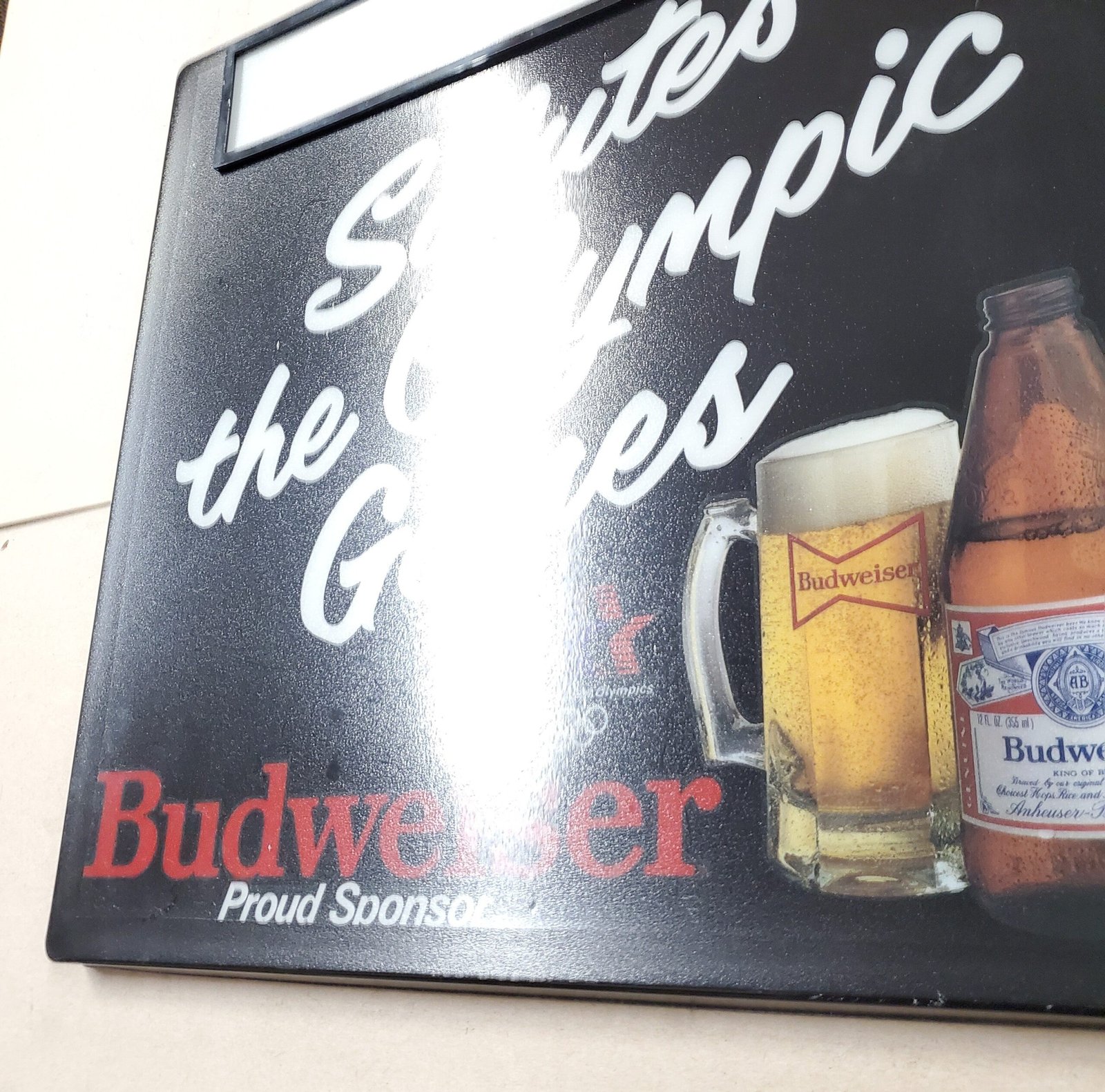 20260313_104053-scaled-1.jpg Plastic Bud Light Beer Sign 1984 Olympic Games Advertisement Breweriana 18" x 18