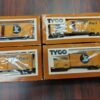 Vintage Tyco HO Scale Train Lot: 11 Boxed Cars, Santa Fe Engine, Tracks, Bridg
