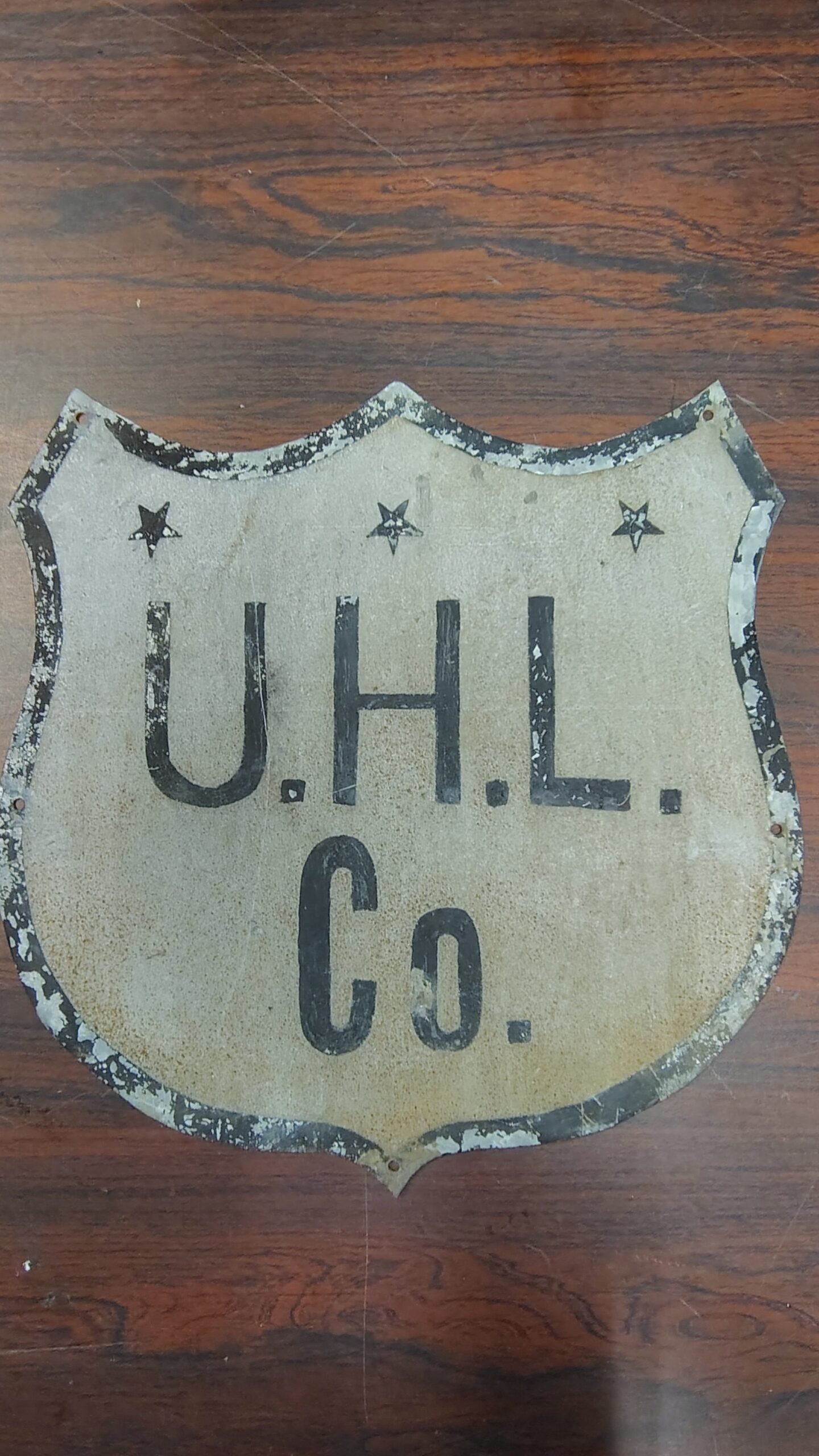 83096ea8-25e6-4fba-a725-0c9ad1a9087c-scaled-1.jpg Antique UHL Co. Metal Shield Sign Industrial Advertising Highway Marker Vtg tin!