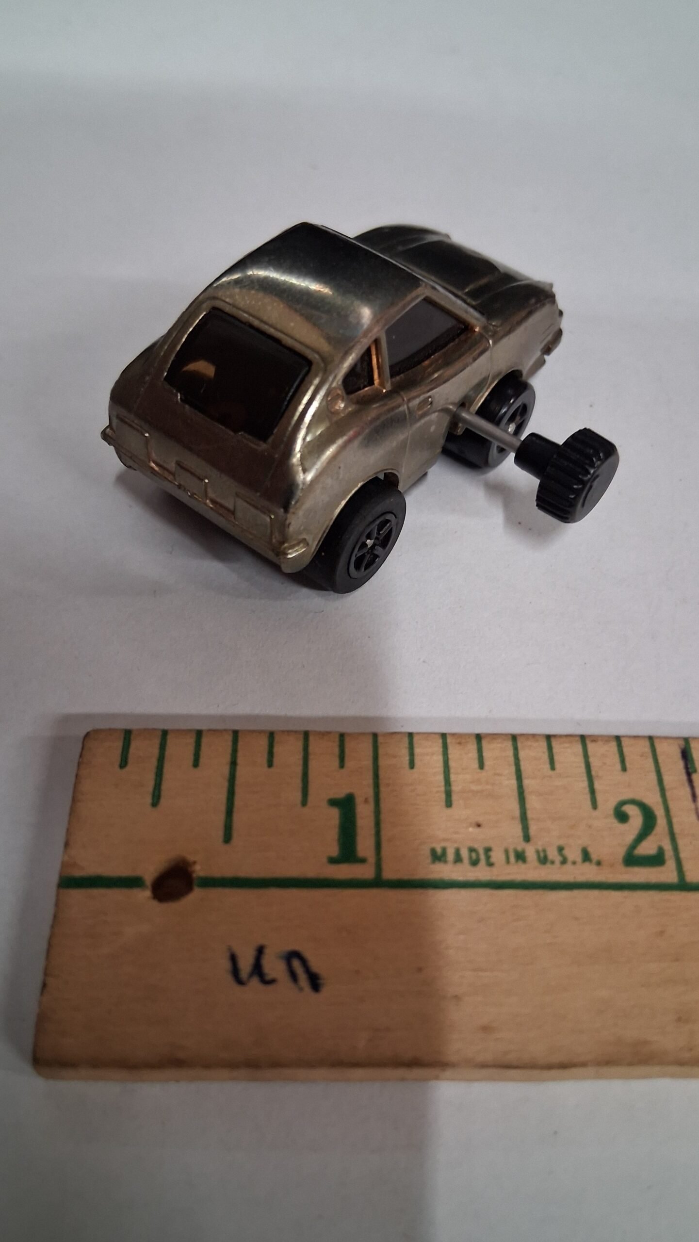 a5b4d2d0-430c-4517-9902-af48a988c8c2-scaled-1.jpg Vintage Knickerbocker 1979 Datsun 240Z Wind Up Car Chrome Works Rubber Rear Tire