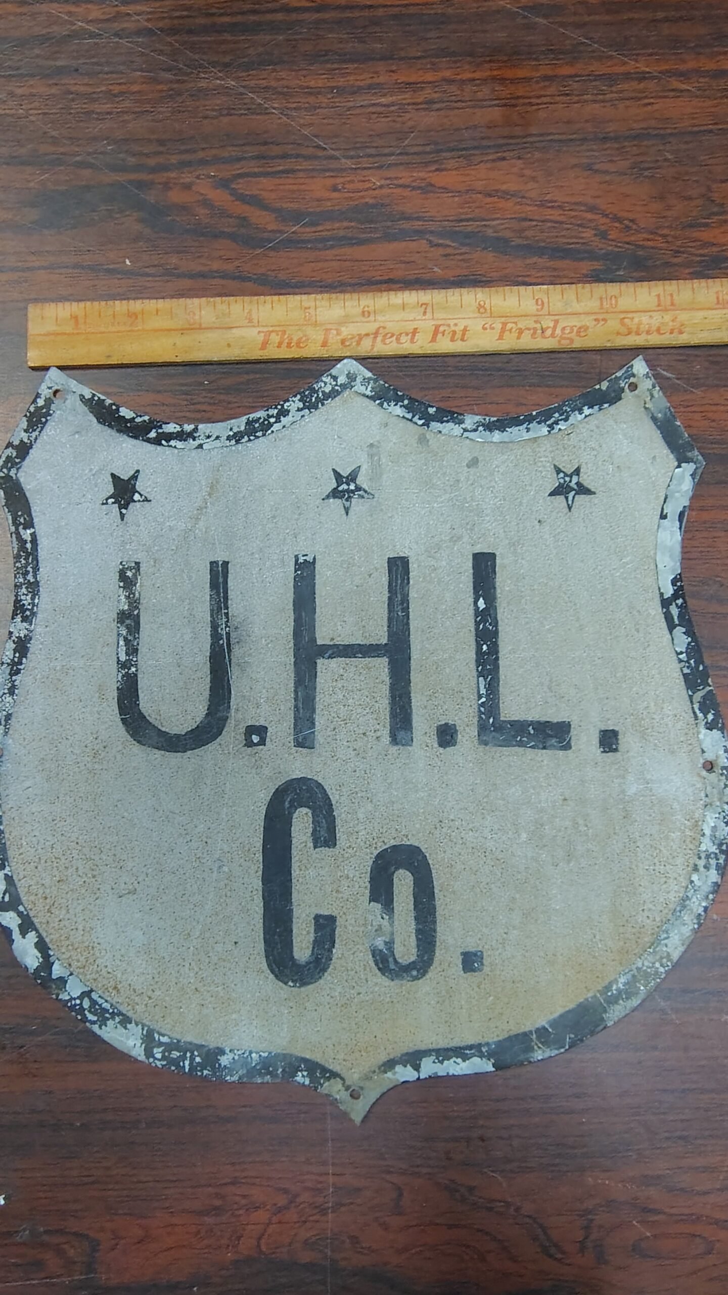 c84db574-f1e0-4969-b4af-f5547d4586e0-scaled-1.jpg Antique UHL Co. Metal Shield Sign Industrial Advertising Highway Marker Vtg tin!