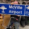 Vtg Sign Mcville Airport Road Street Airplane Oil Gas Advertising 48x15 Garage!